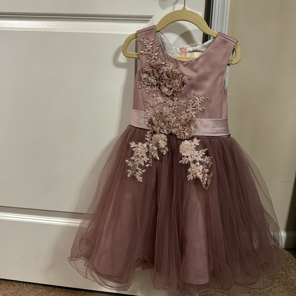 Stunning dusty purple dress. Your little girl will look and feel like a princess
